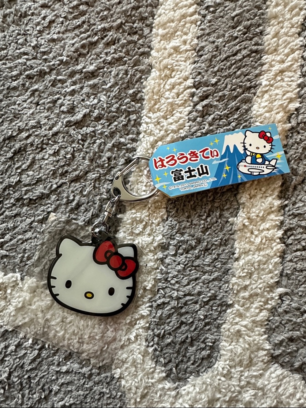 Hello Kitty Mountain Airplane White Face Keychain with Red Bow and Yellow Nose